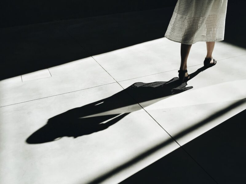 woman walking with shadow